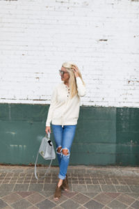 lace up ivory sweater, distressed denim girlfriend jeans, brown suede open toe booties, chunky heel open toe booties, grey handbag with studs