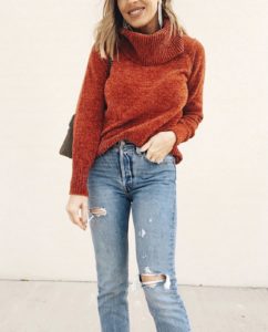 turtleneck sweater and distressed jeans for casual holiday party outfit