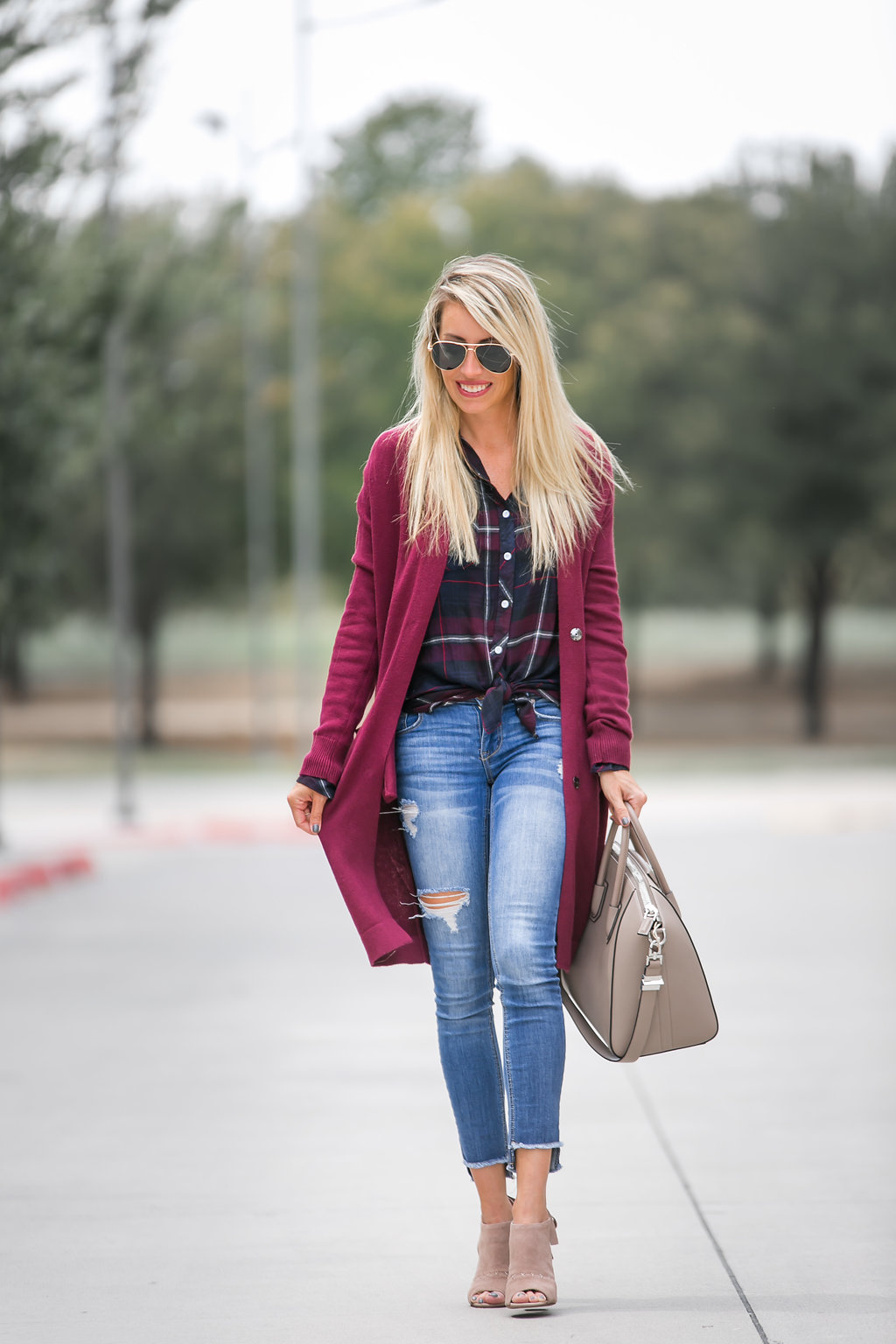 fall colored top and cardigan paired with denim and open toe booties