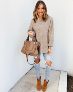 Oversized sweater with distressed denim and booties