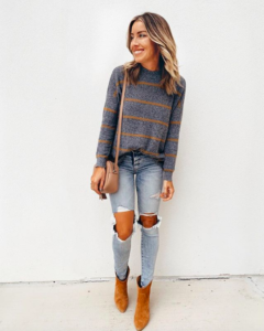 Striped jegging pullover paired with distressed denim and booties