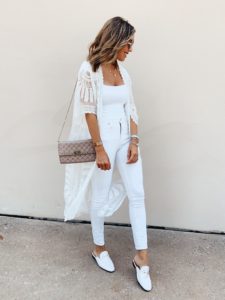 fashion blogger wearing white mule loafers