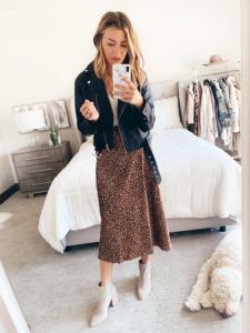 fashion blogger wearing leopard midi skirt and leather moto jacket