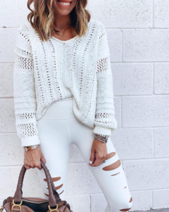 fashion dallas blogger wearing white vneck pointelle sweater with alo white ripped high waist leggings