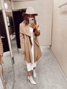 fall outfit idea - tan long cascade long wool coat with white ribbed sleeveless midi dress and white booties