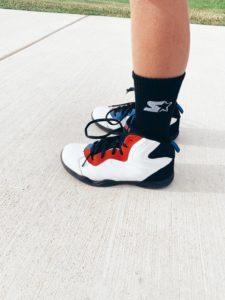fashion kids blogger wearing affordable red white and black and1 walmart athletic sneakers