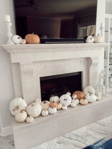lifestyle blogger sharing fall home decor mini white pumpkin arrangement