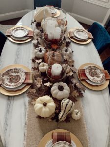 fashion blogger decorating formal dining room for thanksgiving table