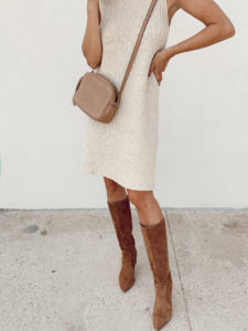 fashion blogger wearing affordable target sleeveless sweater dress