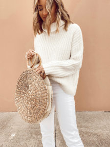 styling a straw bag with a sweater for spring 2020