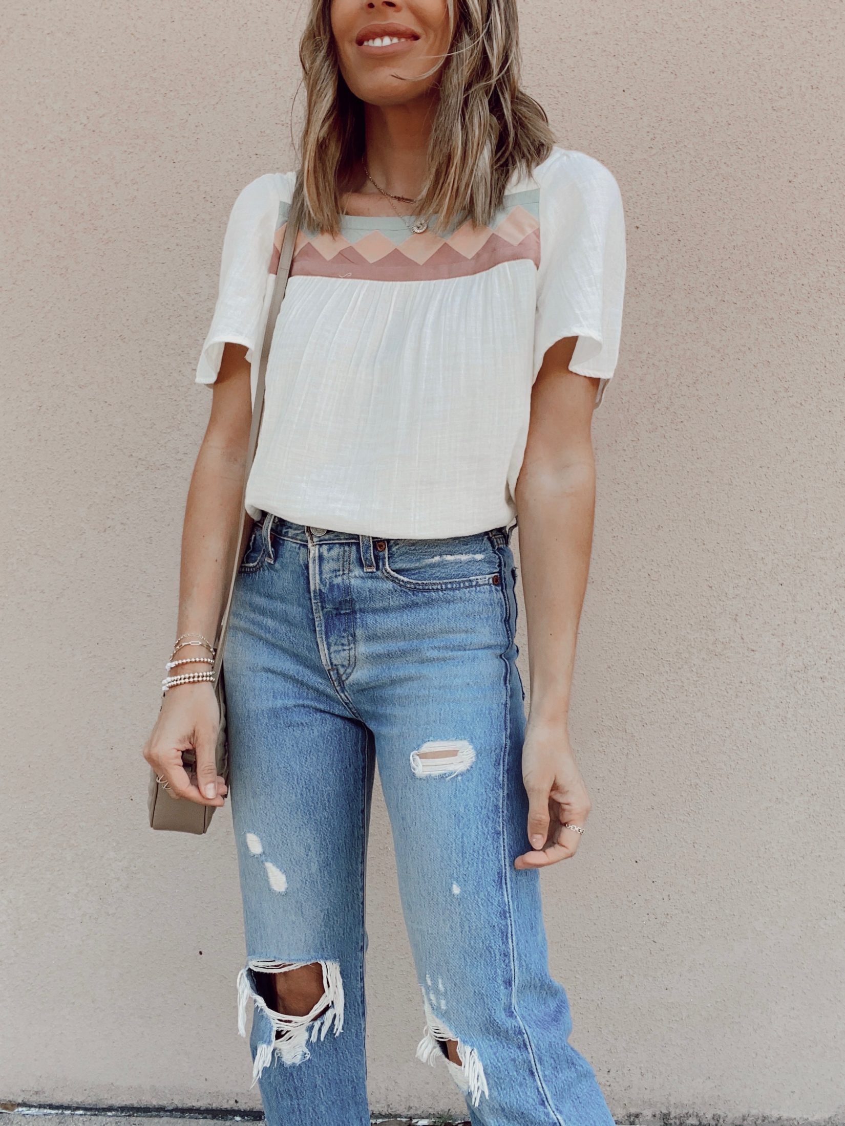 madewell cream patchwork square neck top with Levi’s wedgie icon fit ripped straight leg jeans