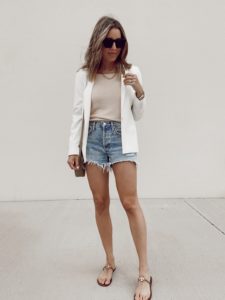 styling white blazer and cutoff jean shorts outfit
