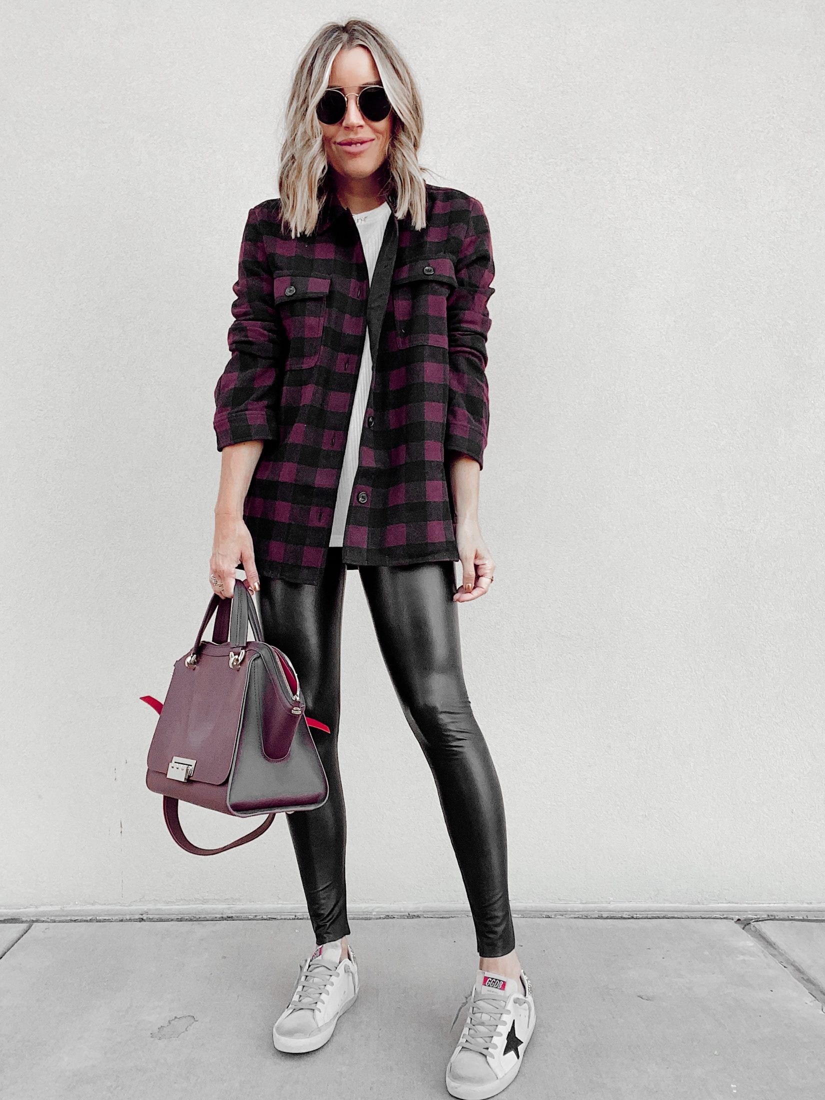 fashion blogger wearing red plaid shacket for fall