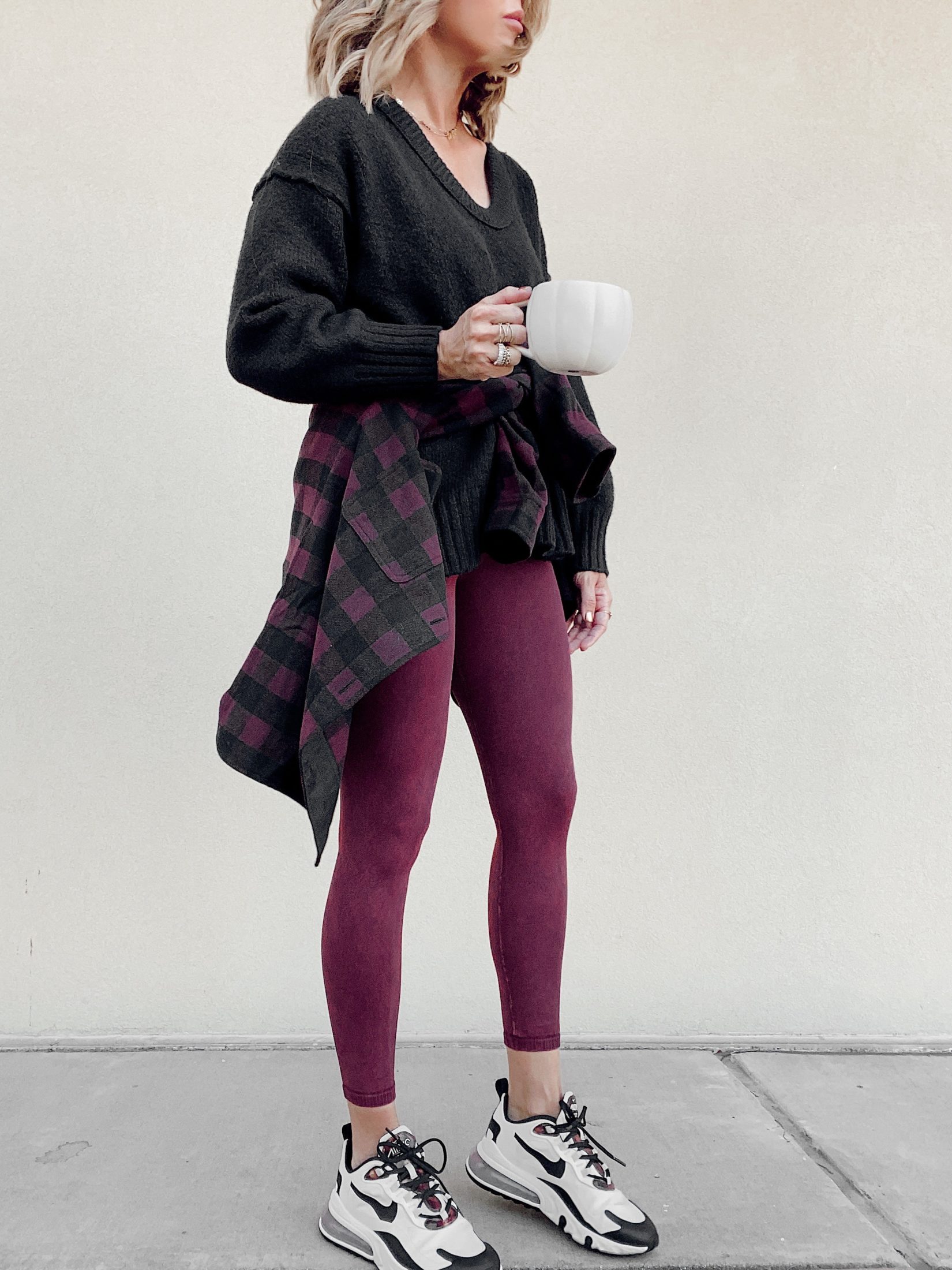 jaime shrayber wearing outfit with plaid shirt tied around waist