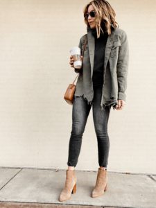 distressed utility shirt jacket with black jeans and ankle booties