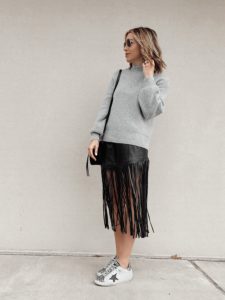 black faux leather fringe midi skirt outfit with sneakers