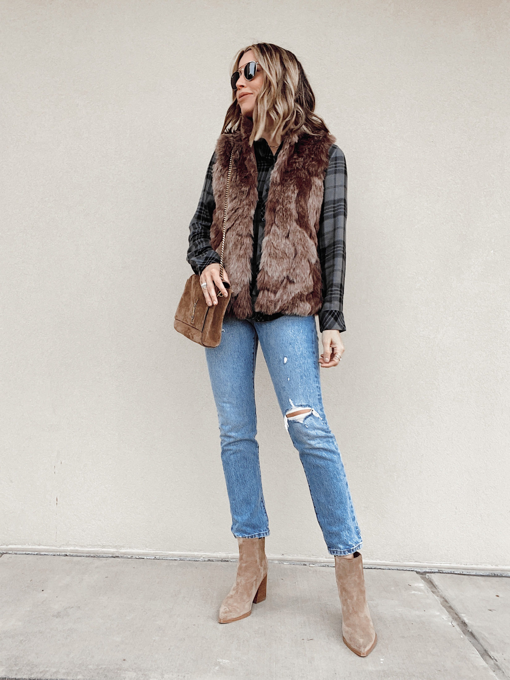 jaime shrayber wearing plaid shirt with brown faux fur vest outfit
