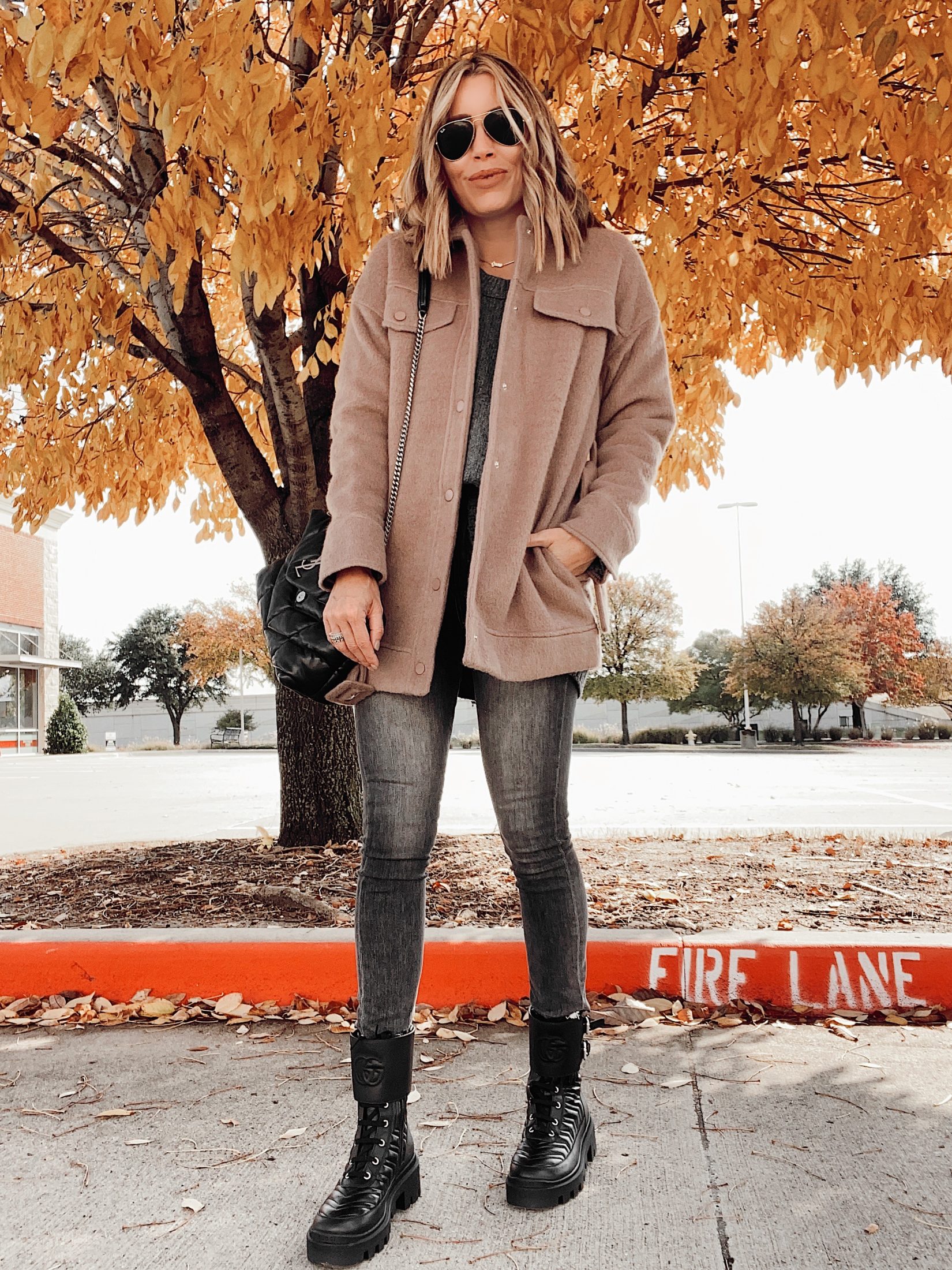 jaime shrayber wearing camel shirt jacket and black combat boots outfit